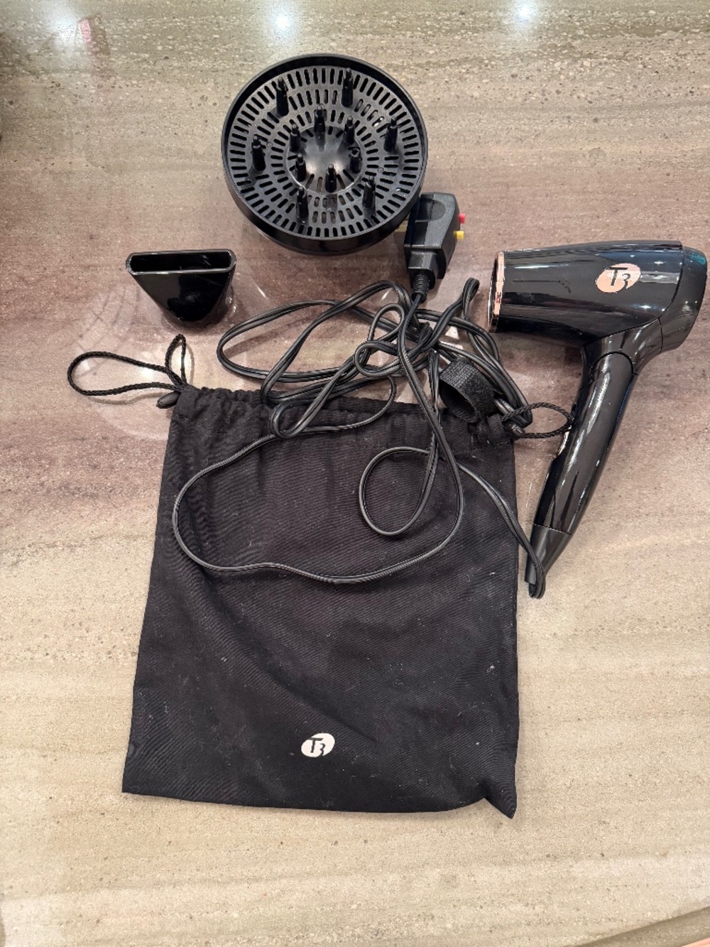 T3 Featherweight folding, dual-voltage travel hair dryer